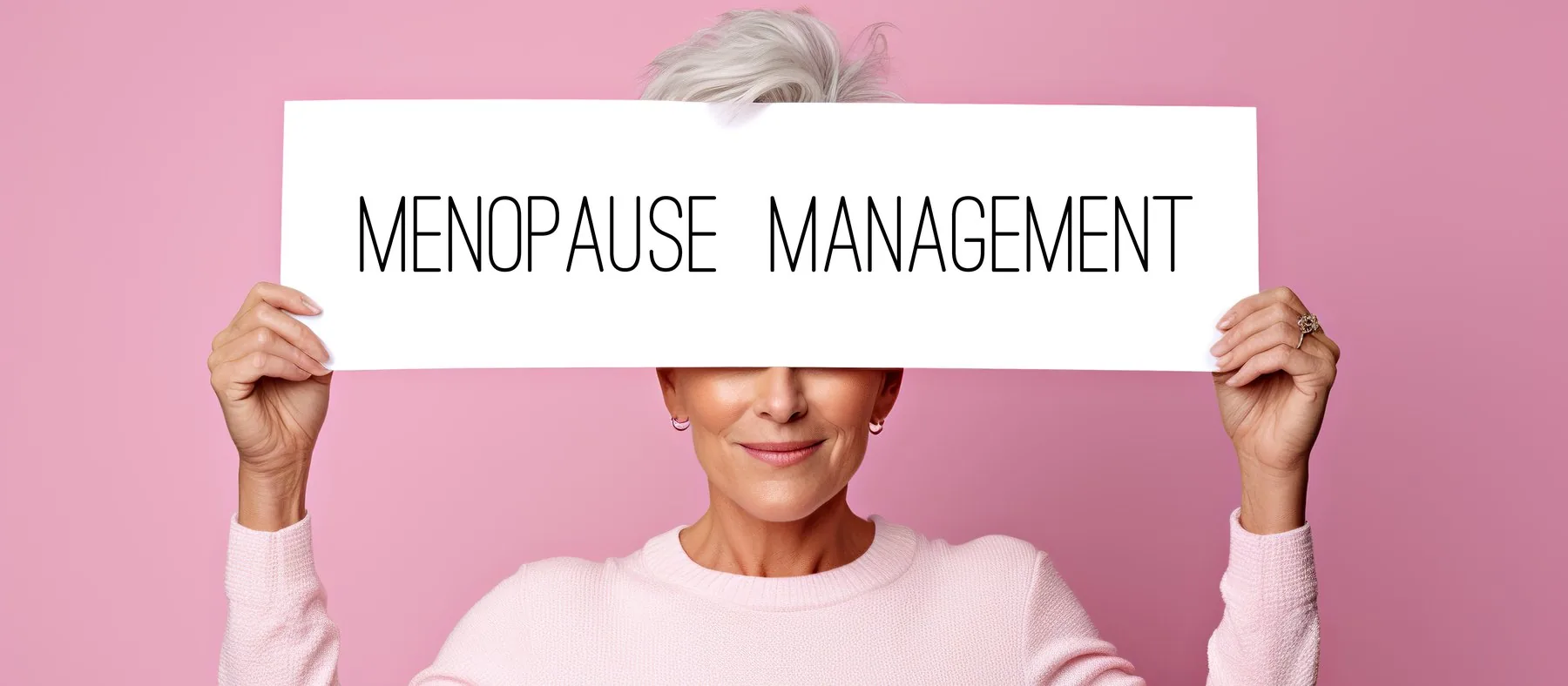 A woman holding a sign reading “menopause management”